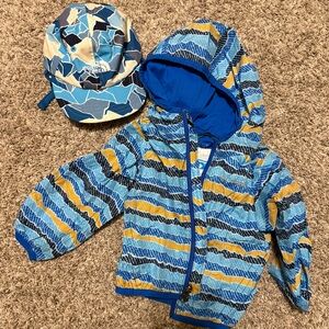 Lined Columbia rain jacket and North Face sun hat